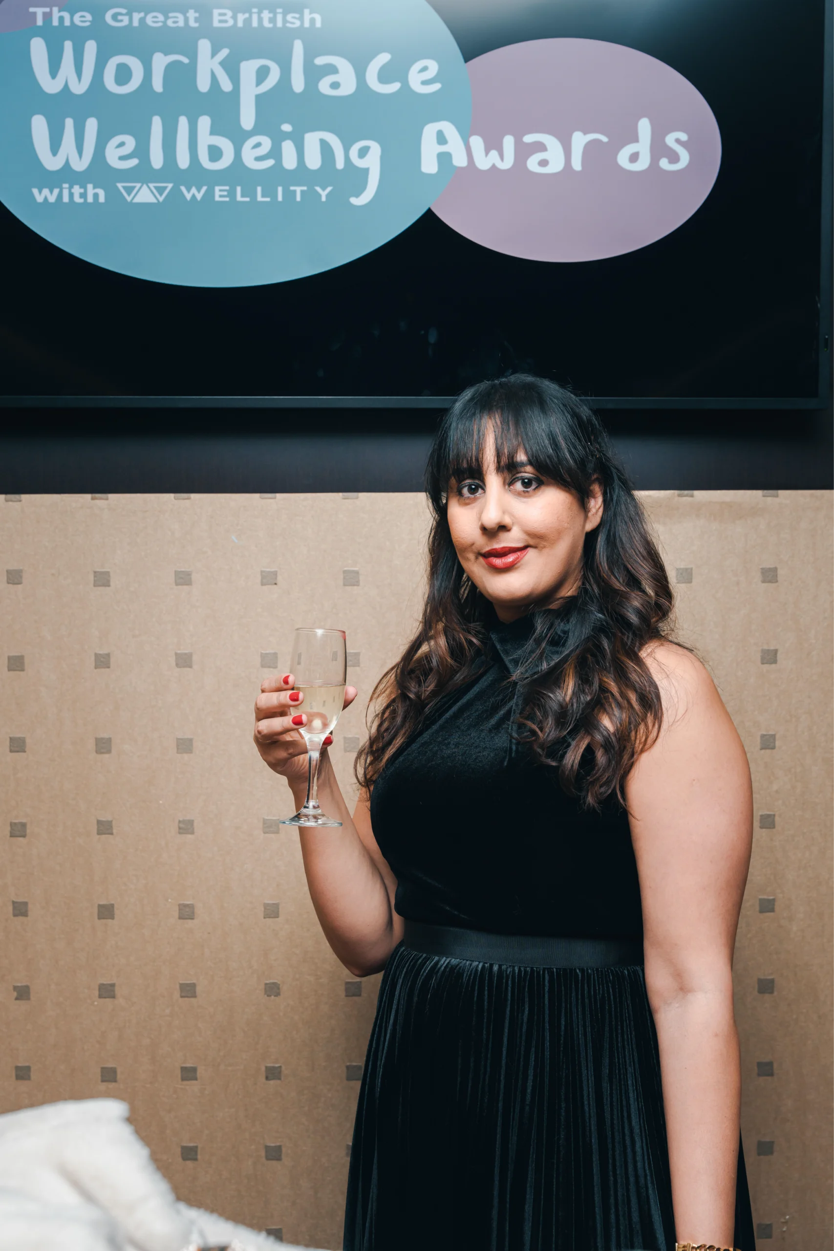 Portrait of Nikita Thakrar speaker in Berkshire UK, award-winning educator, author, and founder of Journey from Karma to Dharma, standing confidently in a professional setting.