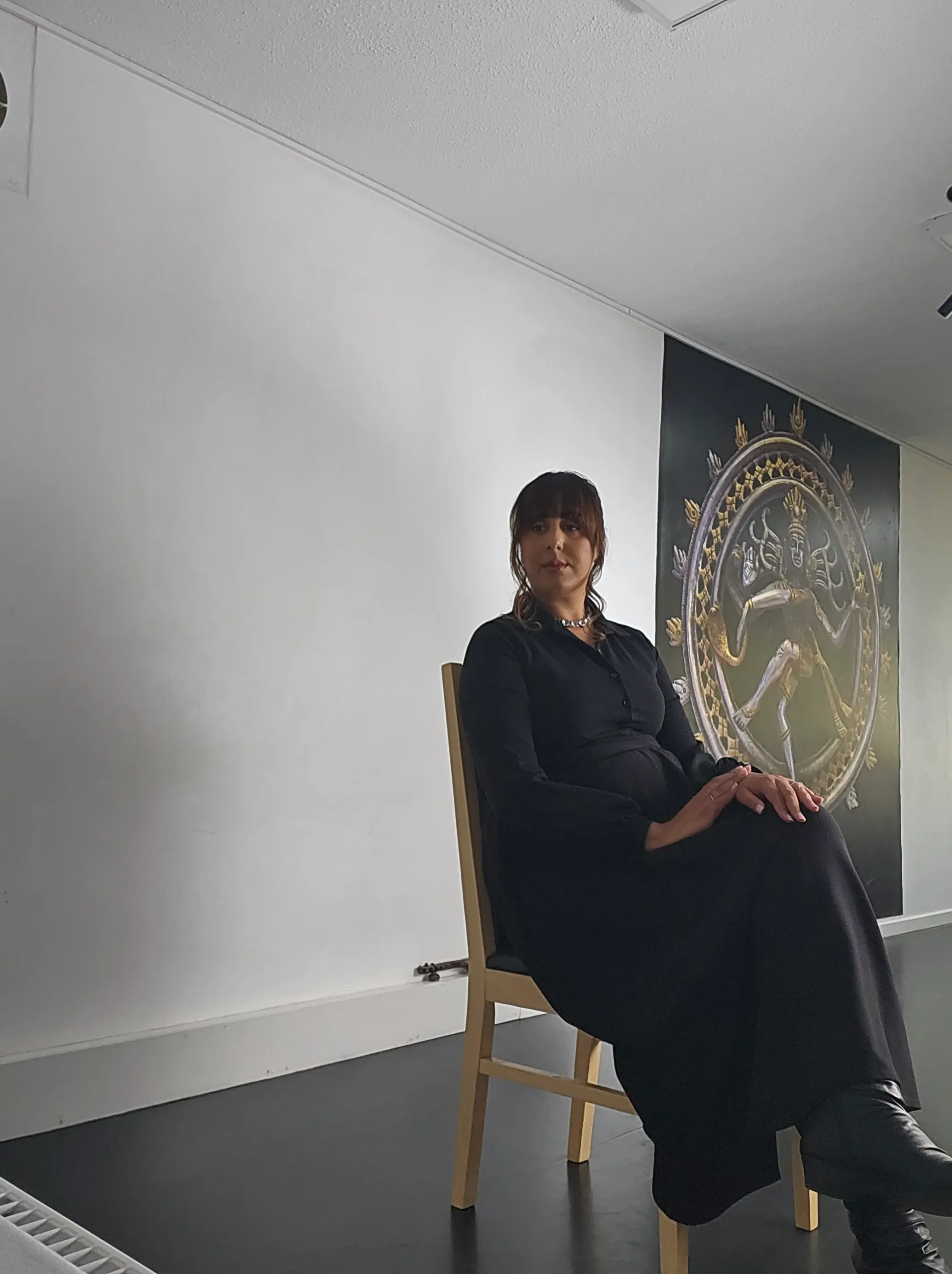 Nikita Thakrar speaker for schools Berkshire UK standing in front of seated secondary school students during a talk on identity, self-awareness, and emotional growth.