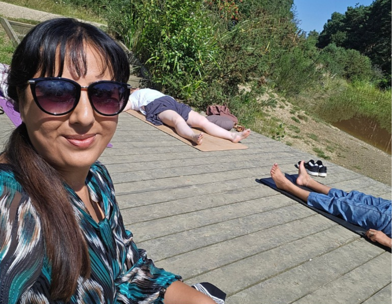 Participants proudly displaying their completed vision boards during the Forest Retreat by Nikita Thakrar in Berkshire, sharing their personal growth insights.