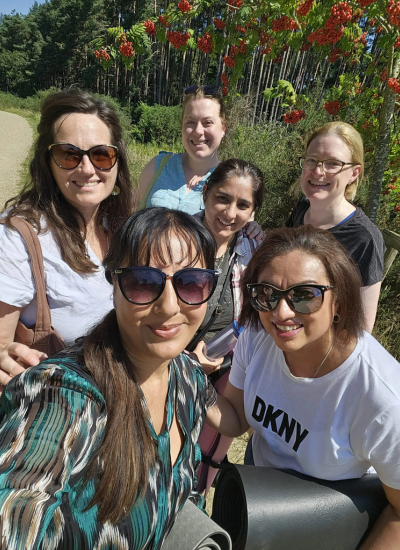 Group photo of forest retreat participants with Nikta Thakrar during the retreat session in berkshire