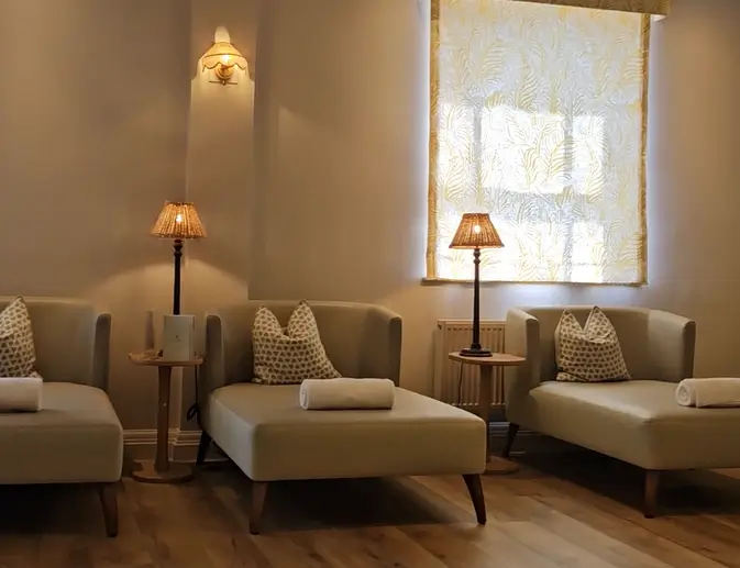Calm indoor relaxation lounge with soft lighting and seating at a luxury wellness retreat in Berkshire, UK